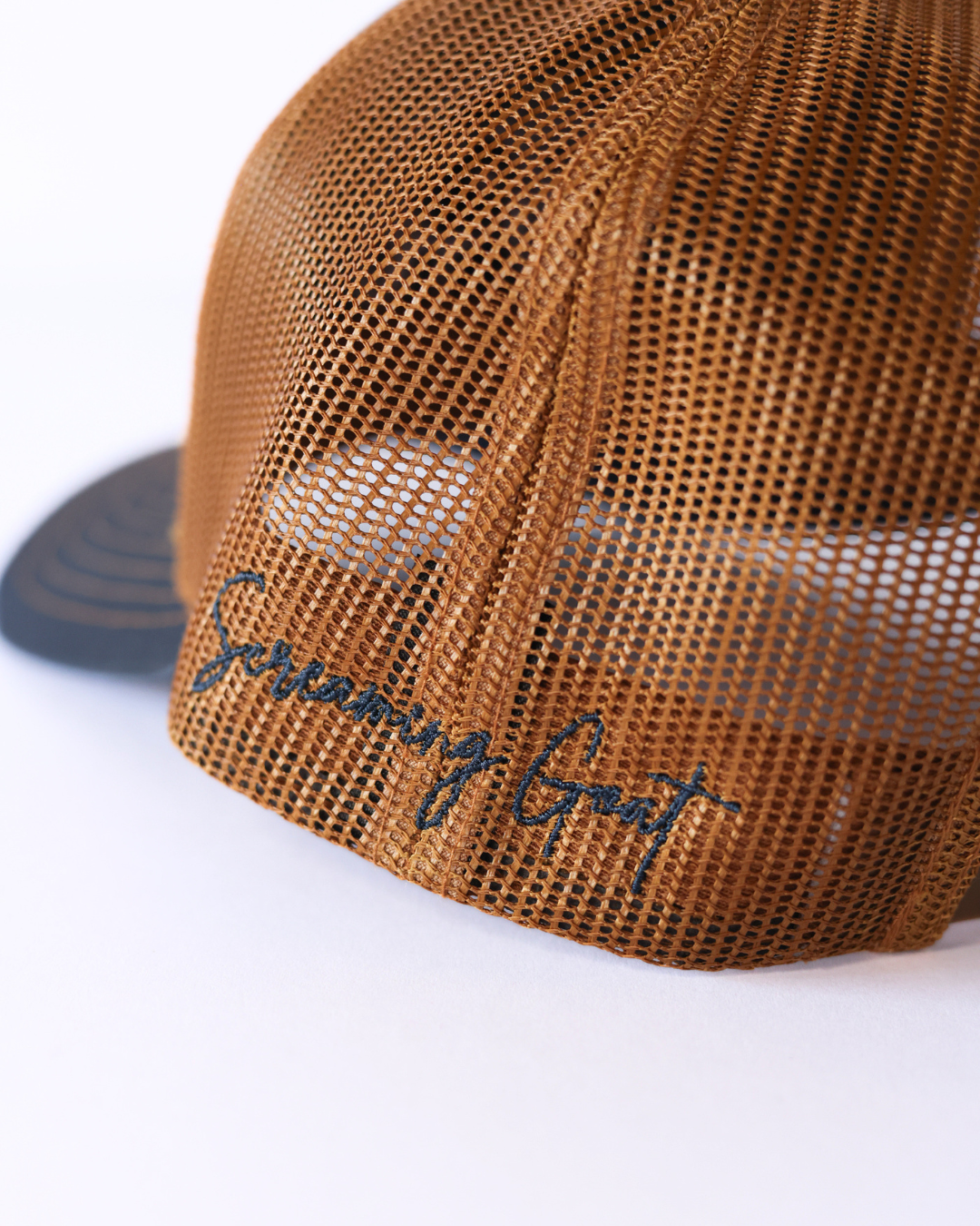 Embroidered Goat Logo Premium Trucker Hat -  Navy & Gold